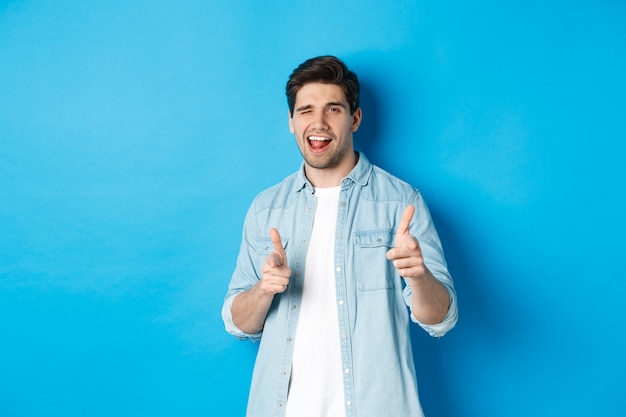 Confident Adult Man Winking and PointingâFree Download Free Stock Photo