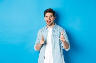 Confident Adult Man Winking and PointingâFree Download Free Stock Photo