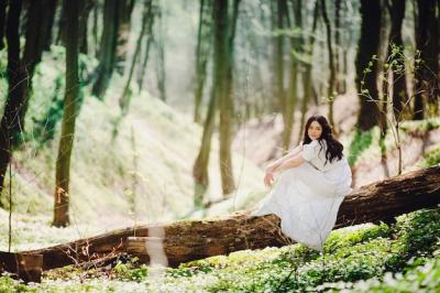 Woman in Elegant White Dress Sitting on Tree on a Sunny Day – Free Download