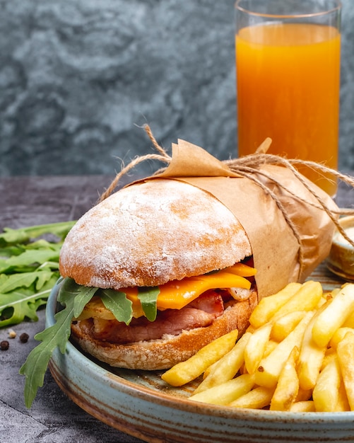 Delicious Chicken Sandwich with Cheddar and Rocket Served with French Fries and Orange Juice – Download Free Stock Photo