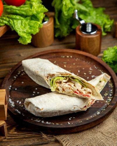 Sliced Chicken Wrap on Wooden Desk – Download Free Stock Photo