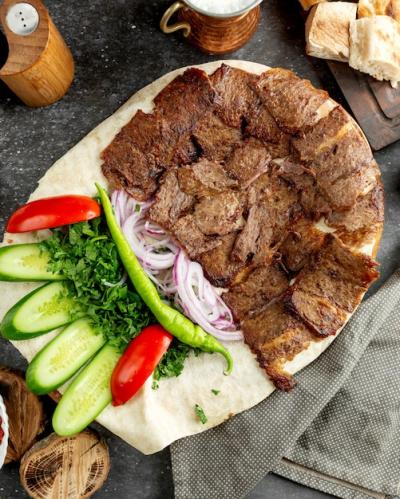 Lamb Doner Slices on Flatbread with Green Salad and Onions – Free Stock Photo Download