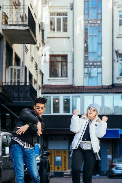 Multi-Ethnic Young Couple Dancing on the Street – Free Download