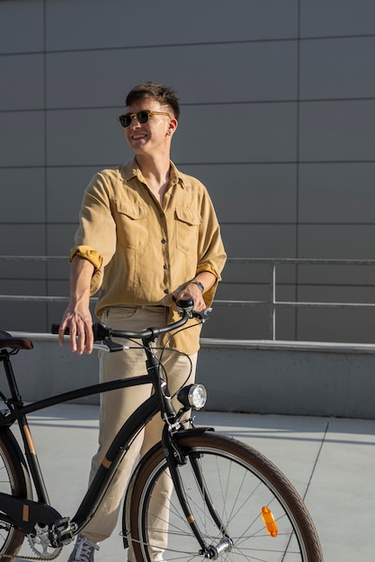 Smiley Man Holding Bike – Free Stock Photo for Download