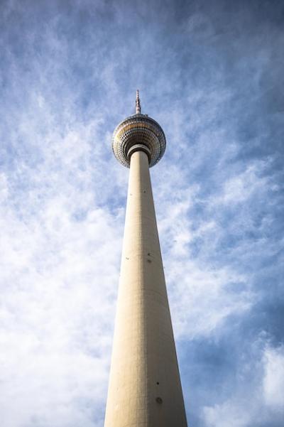 Low Angle View of Communications Tower Against a Cloudy Sky – Free Stock Photo Download