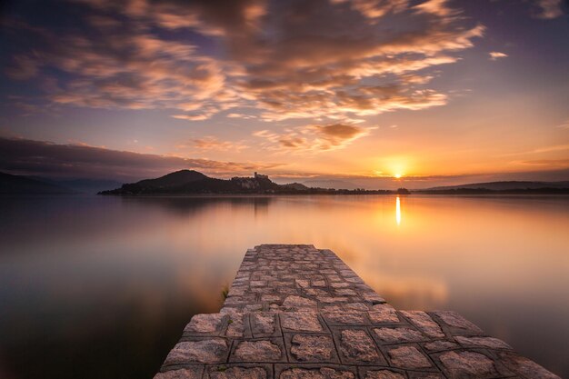 Scenic View of Lake Maggiore at Sunrise with Cloudy Sky – Free to Download