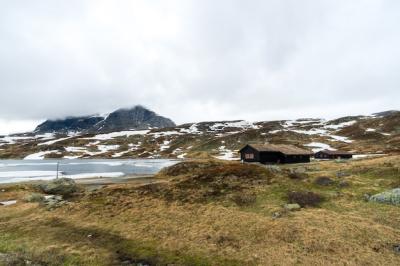 Stunning Winter Scene of Norwegian Houses Surrounded by Snow – Free Download