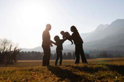 Family Silhouette in Nature at Sunset – Free Download