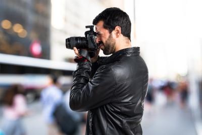 Photographer in Leather Jacket – Free Stock Photo for Download