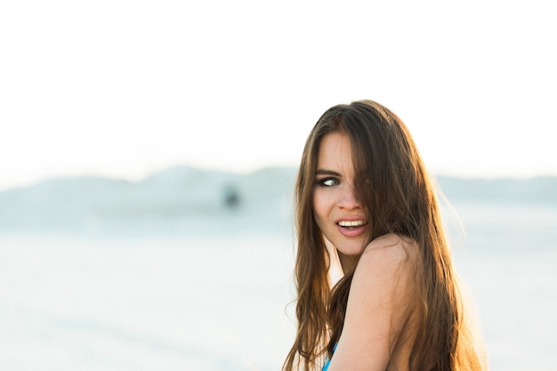 Stunning Woman Playing with Her Hair on the Beach – Free Stock Photo, Download for Free