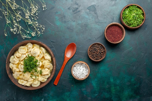 Delicious Dumpling Soup with Seasonings on Dark Green Surface – Free Stock Photo for Download