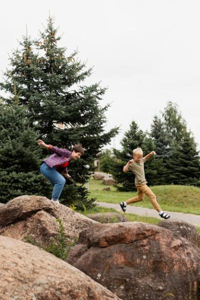 Dynamic Woman and Child Jumping – Free Stock Photo for Download