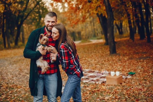 Autumn Park Moments: Elegant Couple Enjoying Nature – Free to Download