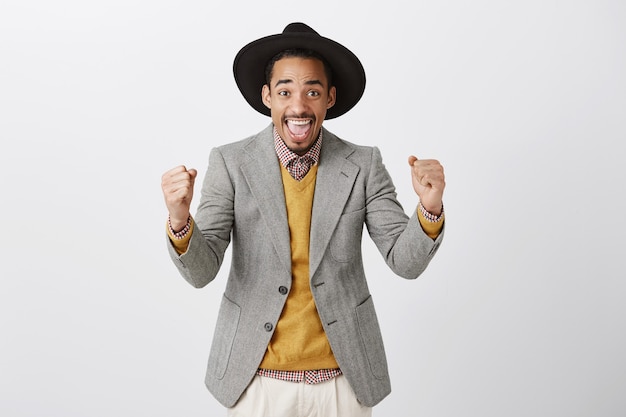 Successful African American Man in Suit Celebrating Victory – Free Download