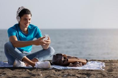 Full Shot of a Man Holding a Smartphone – Free Download