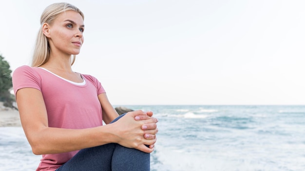 Attractive Blonde Woman Practicing Yoga Outdoors – Free Download