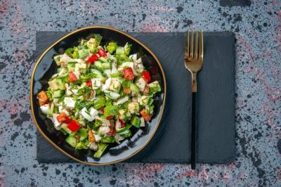 Delicious Vegetable Salad with Cutlery on Dark Background – Free Download