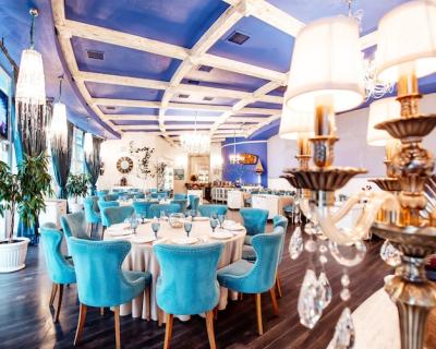 Restaurant Hall Featuring Turquoise Chairs and Classic Chandeliers – Free Download