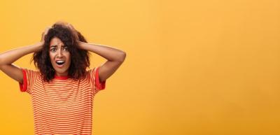 Concerned African American Woman with Afro Hairstyle Looking Worried – Free Download