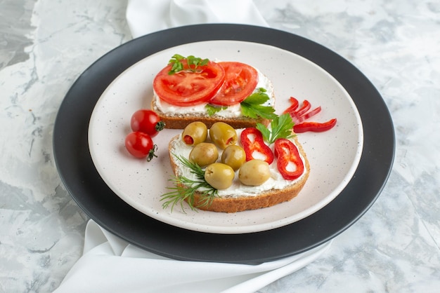 Delicious Sandwiches with Tomatoes and Olives on a White Plate – Free Download