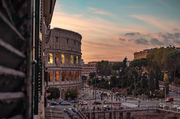 Colosseum Sunset View from a Window in Rome, Italy – Free Download