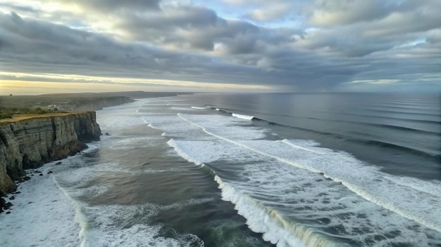 Coastal Cliffs and Rolling Waves Under a Cloudy Sky – Download Free Stock Photo