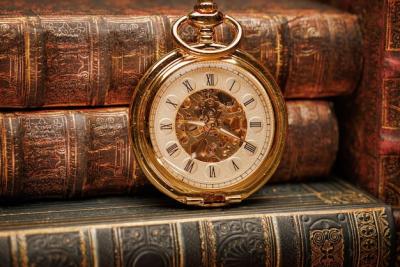 Vintage Antique Pocket Watch Against a Backdrop of Old Books – Free Stock Photo, Download for Free