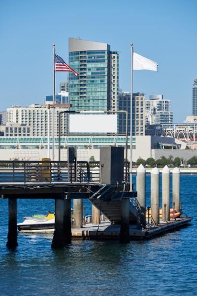 Pier with Kayak Boats and Downtown Skyline in San Diego – Free Download