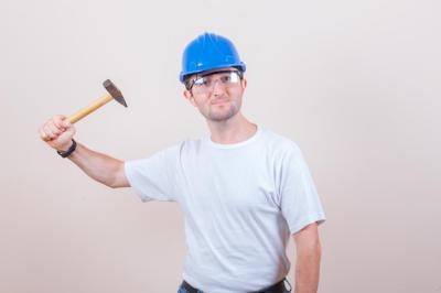 Young Builder with Hammer, T-Shirt, and Helmet – Free Download