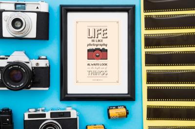 Photo Frame Surrounded by Cameras and Film – Free Download