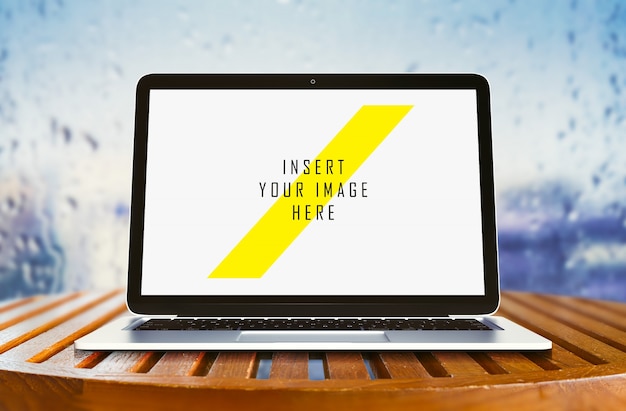 Laptop on Wooden Table Mockup – Free to Download