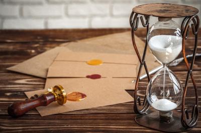 Wooden Desk with Vintage Sandglass and Old Letter â Free Stock Photo for Download