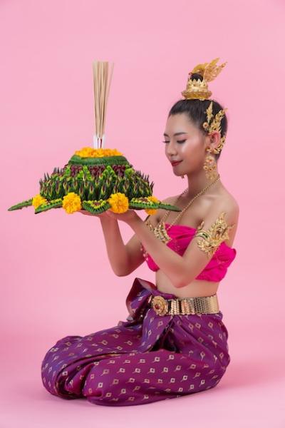 Loy Krathong Festival: Woman in Thai Traditional Outfit Holding Decorated Buoyant – Free Stock Photo for Download