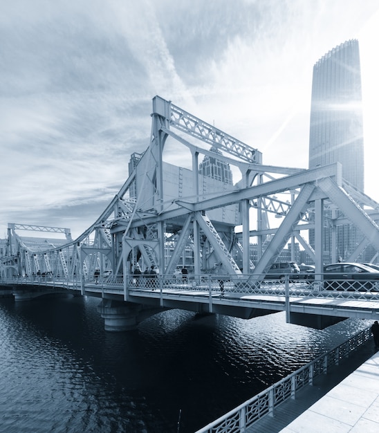 Modern Buildings by the River Under a Clear Sky – Free Stock Photo for Download