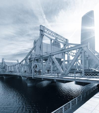 Modern Buildings by the River Under a Clear Sky – Free Stock Photo for Download