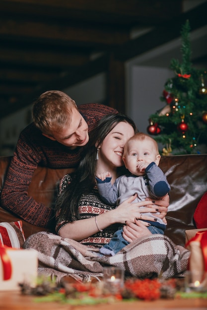 Heartwarming Moment: Woman Kissing Baby with Father’s Smile – Free Stock Photo, Download for Free