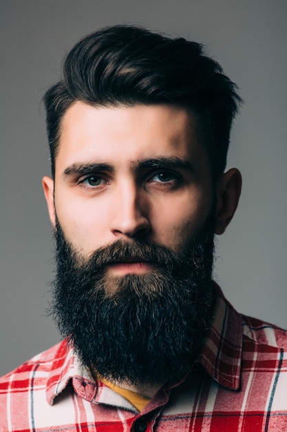 Handsome Bearded Young Man Portrait on Gray Wall – Free Download