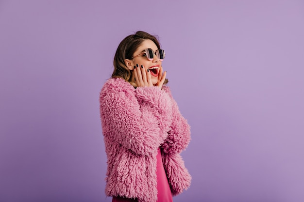 Amazed Woman Posing in Eco Coat – Free Stock Photo for Download