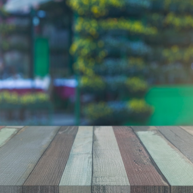 Wood Table with Blurry Garden Backdrop – Free Stock Photo for Download