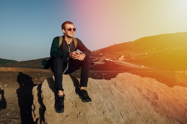 Happy Man Enjoying Music at Sunset – Free Stock Photo for Download