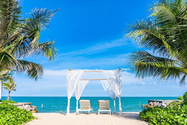 White Arch and Deck Chairs at Tropical Beach – Free Stock Photo for Download