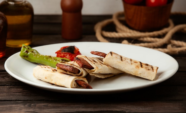 Fried Sausage in Pita Bread on a Wooden Table – Free Stock Photo for Download