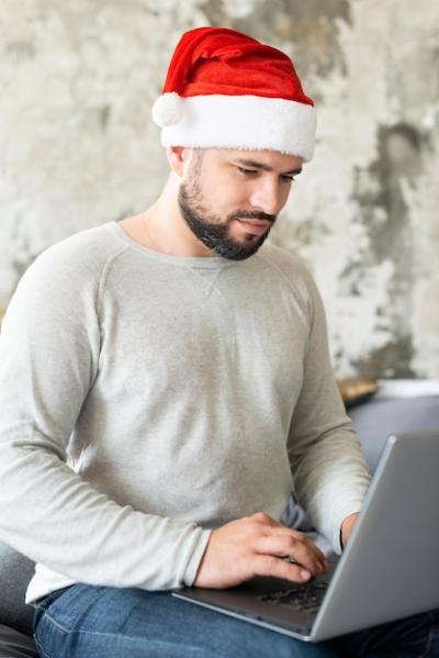 Christmas Day Laptop Enthusiast in Santa Hat – Free Download