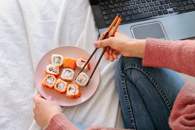 High Angle Woman Holding Sushi – Free Stock Photo for Download