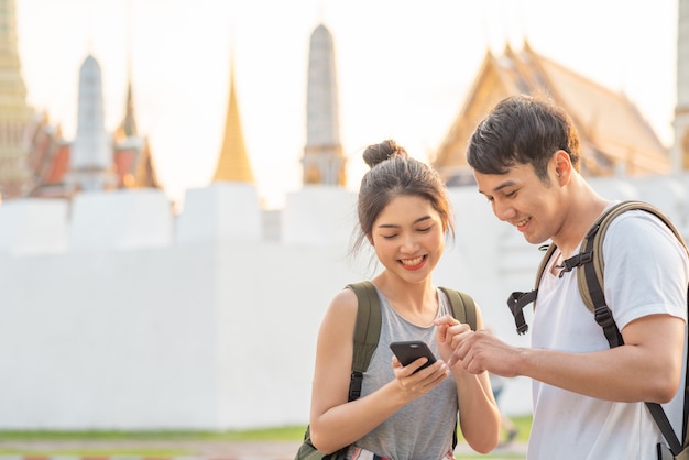 Asian Couple Navigating Bangkok, Thailand – Free to Download