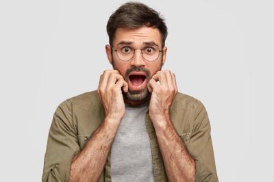 Frightened Emotive Bearded Young Male Expressing Fear and Disbelief – Free Stock Photo for Download