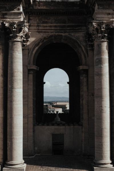 Inside a Temple with Arch Window Overlooking a Beautiful Cityscape – Free Stock Photo Download