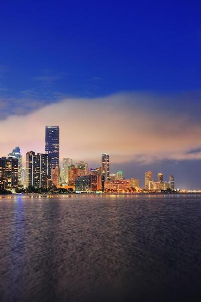 Miami City Skyline Panorama at Dusk – Urban Skyscrapers Over Sea with Reflection | Free Download