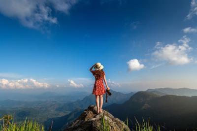 Woman Hand Holding Camera on Top of a Rock in Nature – Free Download