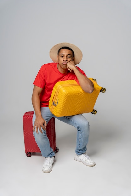 Full Shot of a Man Posing with Baggage – Free Download